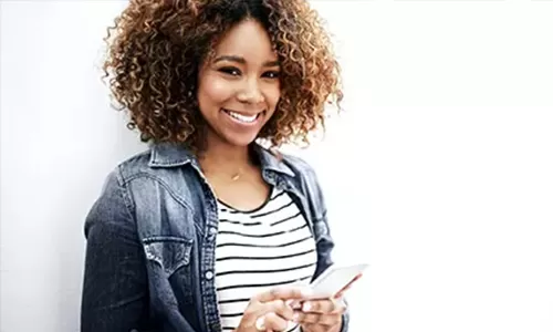 Woman happy with rewards - Oregon State Credit Union Woman happy with rewards - Oregon State Credit Union